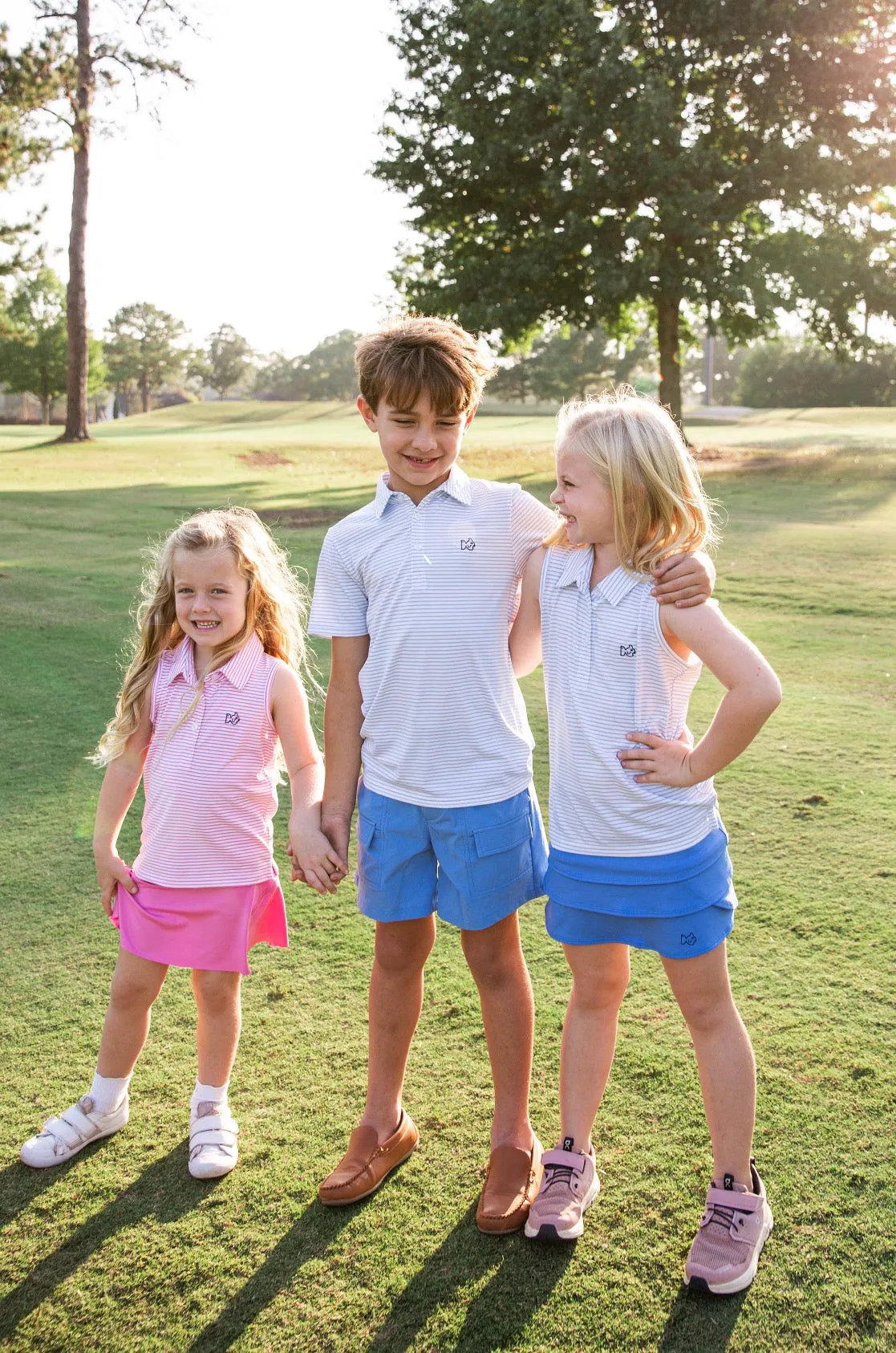Girls Sleeveless Pro Performance Polo Shirt in Fuchsia Pink Stripe